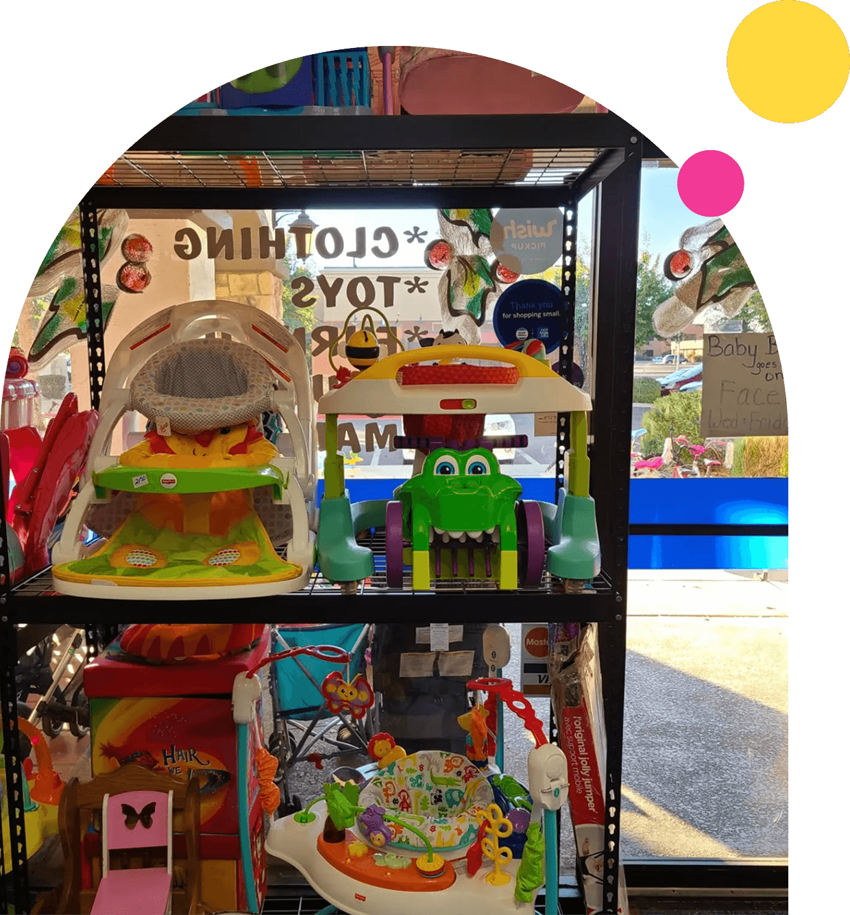 Colorful baby toys displayed on store shelf.
