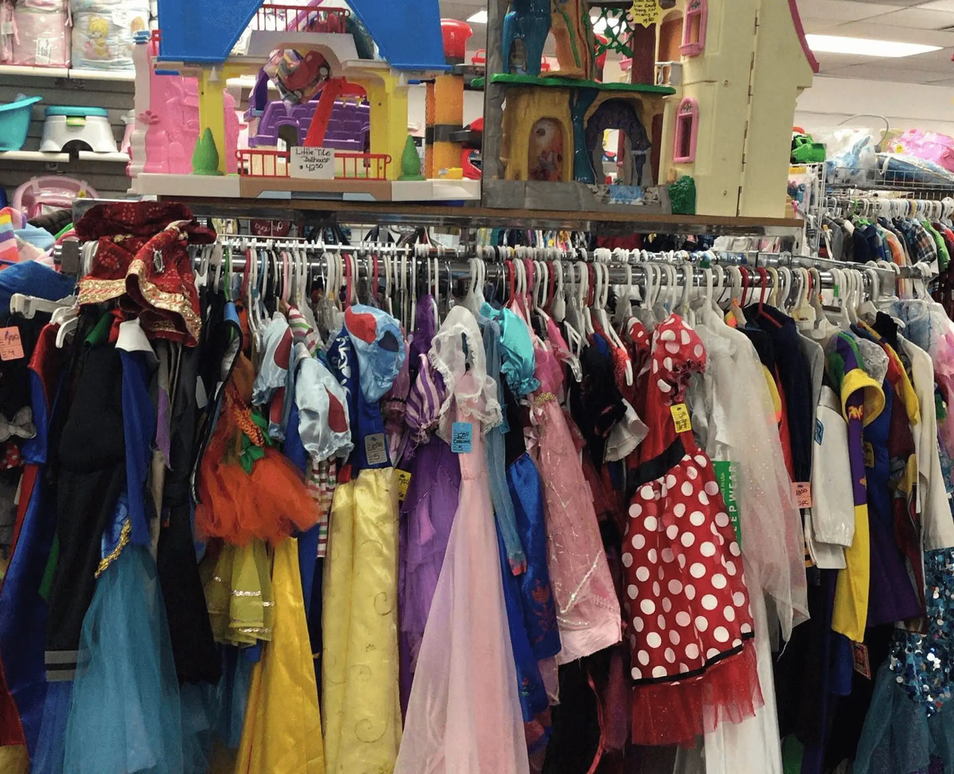 Children's costumes hanging in thrift store.